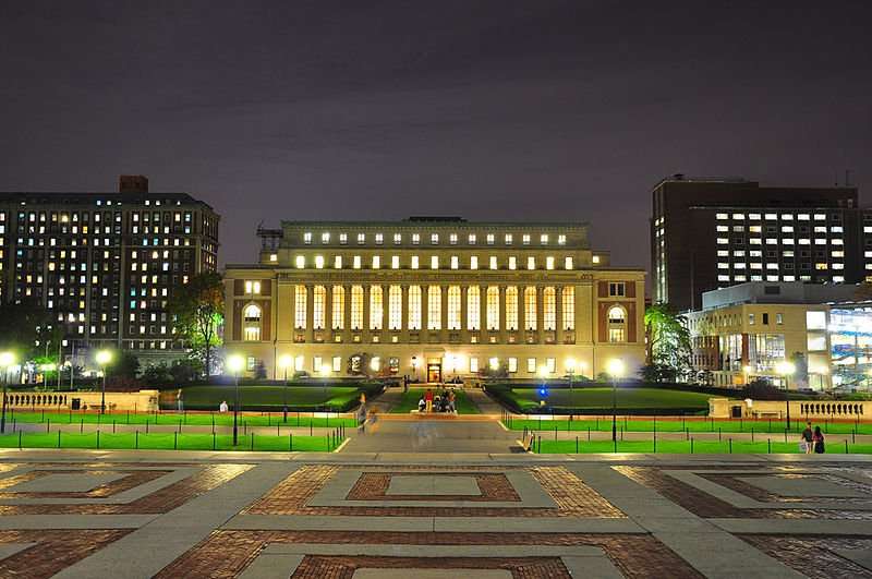 This is a wide shot of Columbia University lit up at night.
